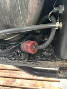 Blocked and contaminated diesel fuel filter on industrial hot pressure washer before full service and refurbishment